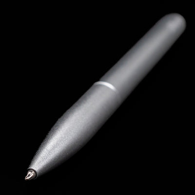 Full view of the Stilform PEN Ballpoint Pen – Comet Grey Aluminum at an angle showcasing its tip.