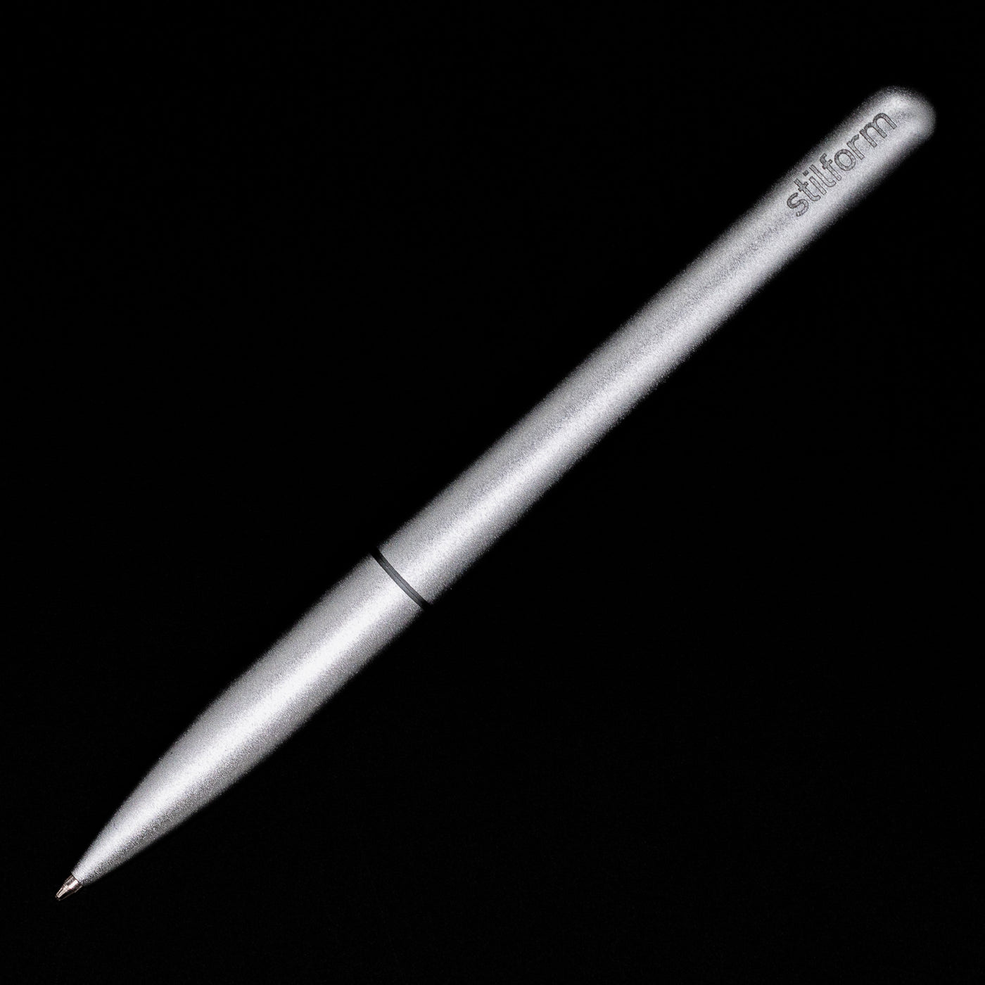 An overhead view of the Stilform PEN Ballpoint Pen – Comet Grey Aluminum activated.