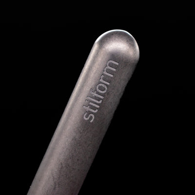 A macro shot of the logo on the cap of the Stilform PEN Ballpoint Pen – Titanium DLC.