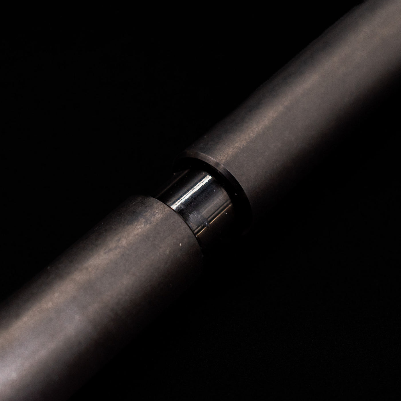 A macro shot of the part that activates the Stilform PEN Ballpoint Pen – Titanium DLC.