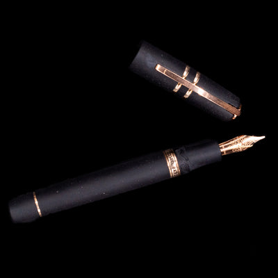 An overhead view of the Visconti Homo Sapiens Bronze Age Fountain Pen - Architect Nib uncapped.