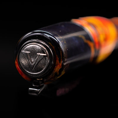Zoomed-in detail of the top of the cap, with the Visconti finial on the Visconti Homo Sapiens Earth Origins Fire edition fountain pen.