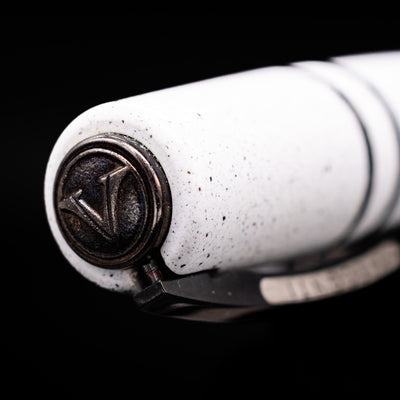 Zoomed-in view of the top of the cap with the finial on the Visconti Homo Sapiens Fountain Pen - Blizzard White.