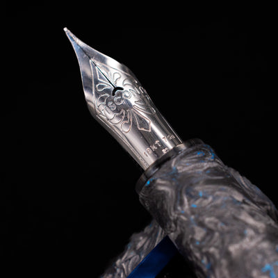  A macro shot of the nib with its intricate detailing and logo engraving for the Visconti Homo Sapiens Fountain Pen - Carbon Abyssus.