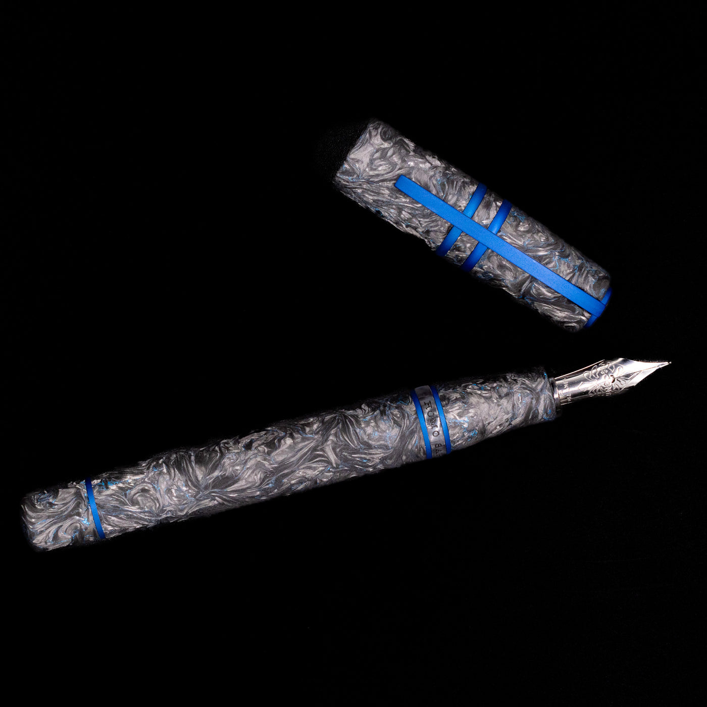 An overhead view of the Visconti Homo Sapiens Fountain Pen - Carbon Abyssus uncapped.