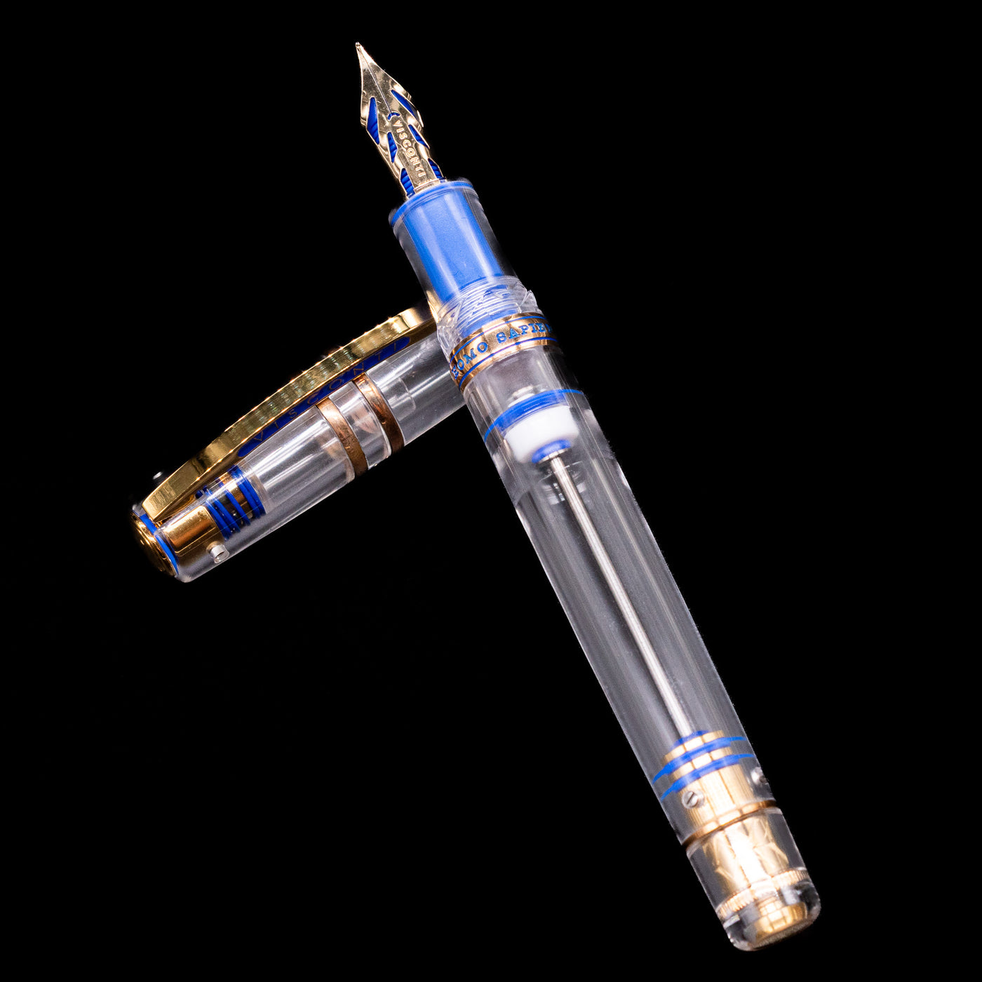 The Visconti Homo Sapiens Full Demo fountain pen’s uncapped body crossed neatly over its cap, showing the transparent design.