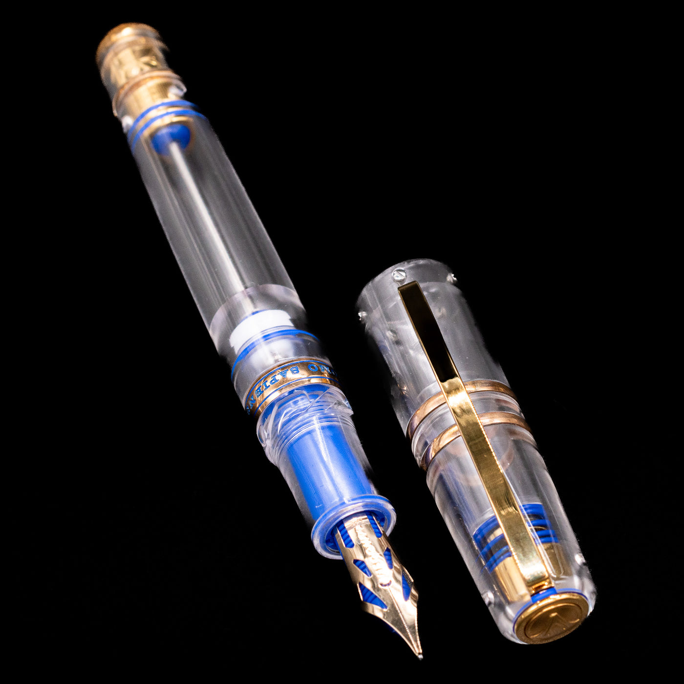 Full-length shot of the uncapped Visconti Homo Sapiens Full Demo fountain pen, showcasing the transparent barrel and nib.