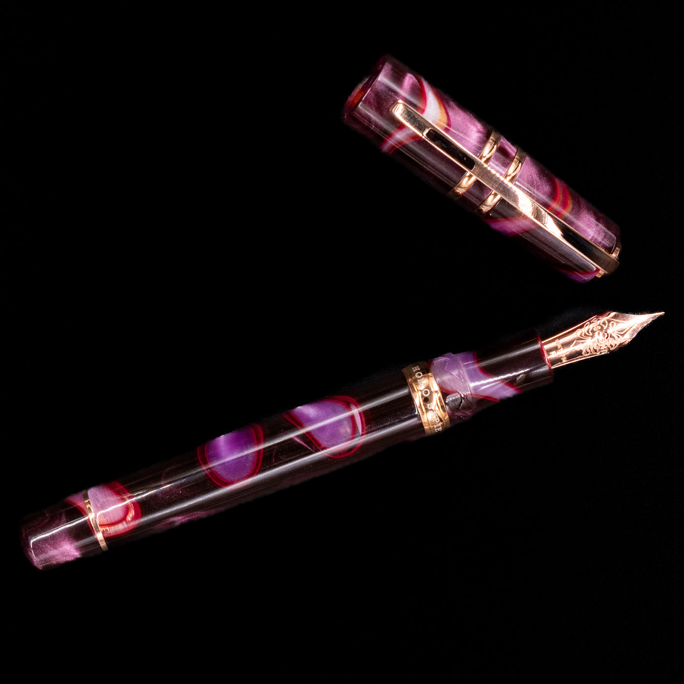 An overhead view of the Visconti Homo Sapiens Iris Garden Fountain Pen uncapped.