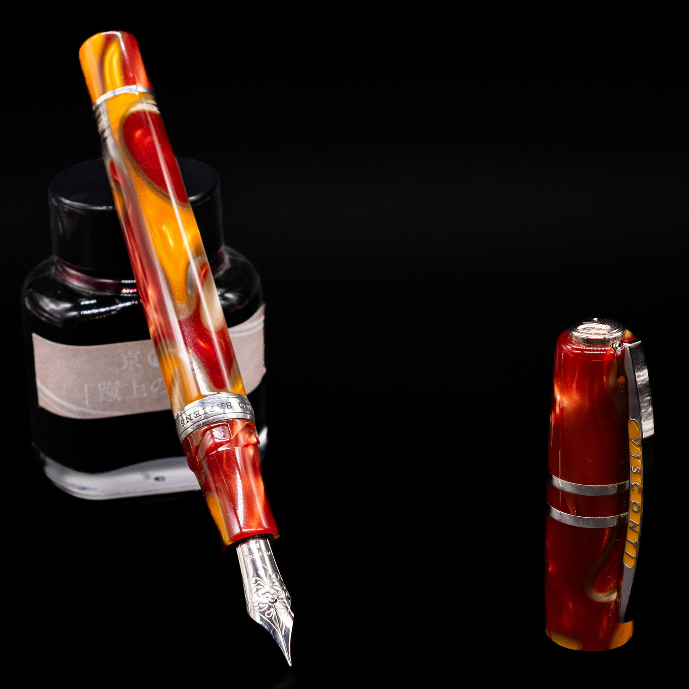 Visconti Homo Sapiens Limited Edition Fountain Pen - Arizona Sunset leaning on an ink bottle uncapped showcasing the detailing on the nib.