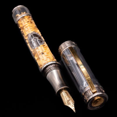 A full view of the Visconti Limited Edition Fountain Pen - Maze uncapped, with its cap laying next to the pen. 