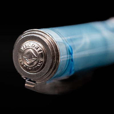 Zoomed-in view of the top of the cap with the finial on the Visconti Manhattan Fountain Pen - Ice Blue.