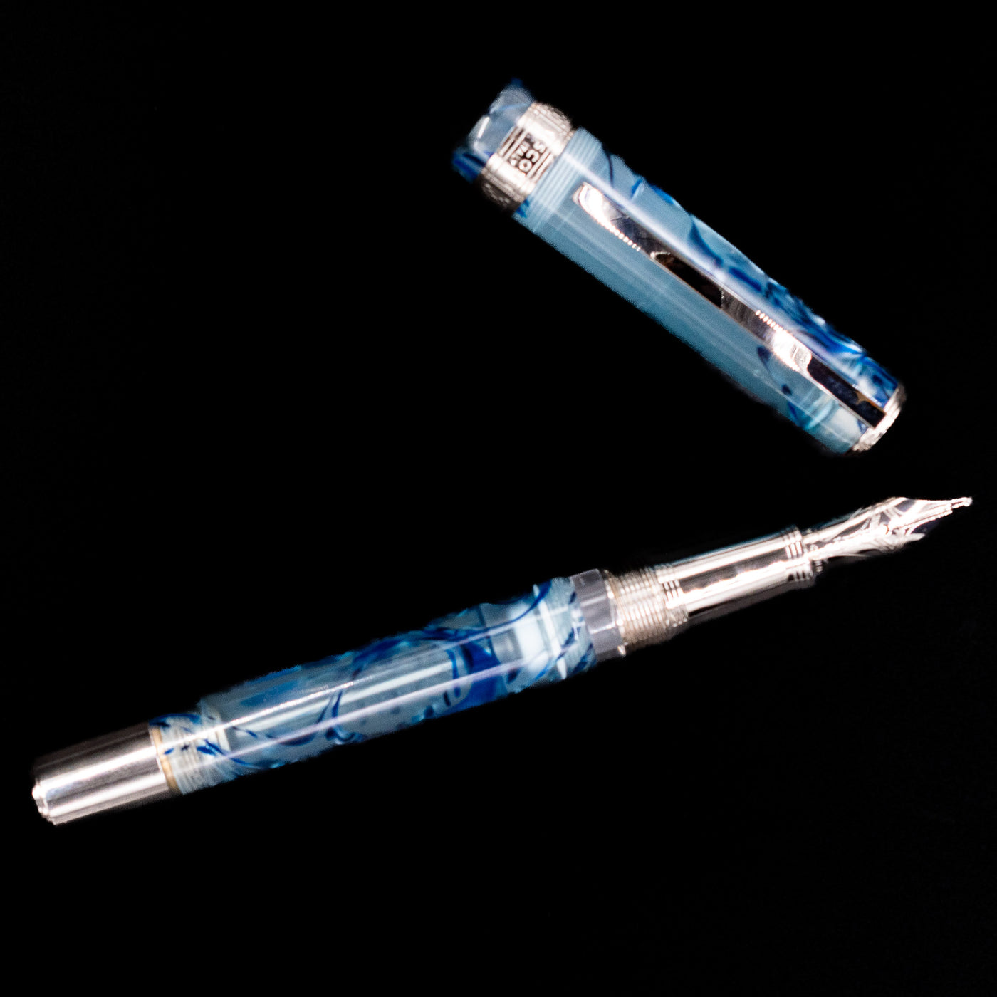 An overhead view of the Visconti Manhattan Fountain Pen - Ice Blue uncapped.