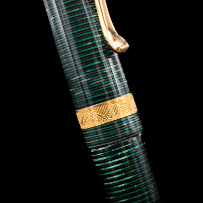 A close-up shot of the center band on the Visconti Manhattan Green Celluloid Fountain Pen - Preowned.