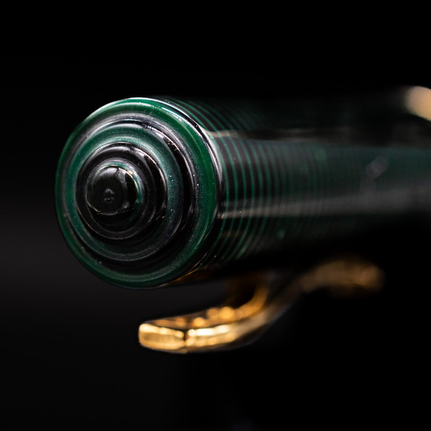 Zoomed-in view of the top of the cap with the finial on the Visconti Manhattan Green Celluloid Fountain Pen - Preowned.