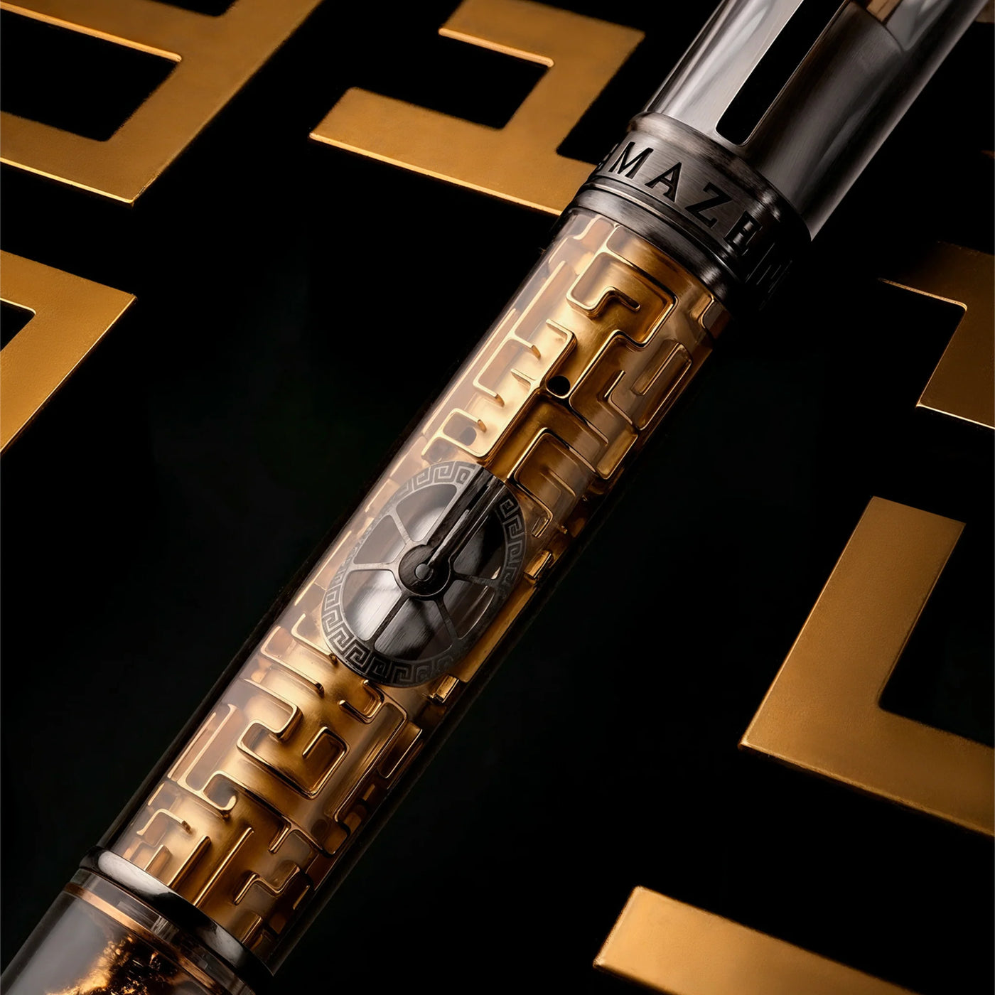 Visconti Maze Fountain Pen capped with transparent barrel showing golden labyrinth.