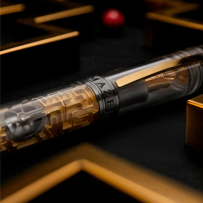 Close-up of ruby sphere inside the golden maze of Visconti Maze pen.
