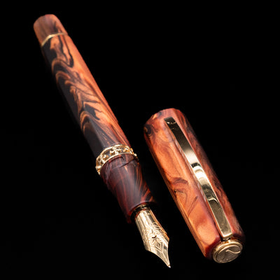 Full view of the Visconti Medici Briarwood Fountain Pen in Gold uncapped with its cap by its side.