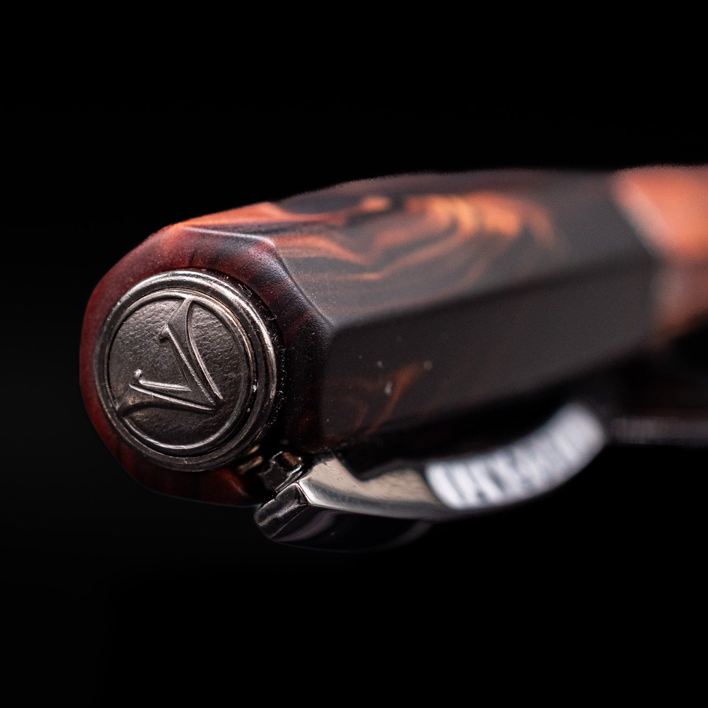 Zoomed-in view of the top of the cap with the Visconti finial on the Visconti Medici Briarwood Fountain Pen in Ruthenium.