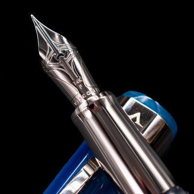 A macro shot of the nib with its intricate detailing and logo engraving for the NVisconti Opera Carousel Fountain Pen - Blue Cotton Candy.