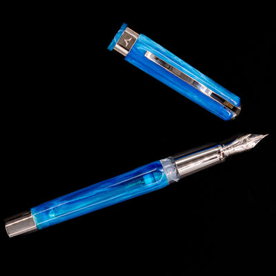 An overhead view of the Visconti Opera Carousel Fountain Pen - Blue Cotton Candy uncapped.