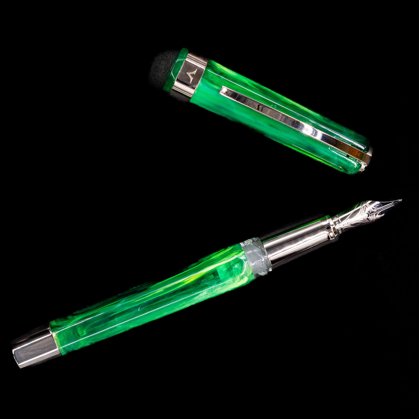 An overhead view of the Visconti Opera Carousel Fountain Pen - Green Mint uncapped.
