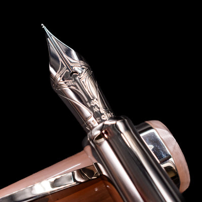 A macro shot of the nib with its intricate detailing and logo engraving for the Visconti Opera Carousel Fountain Pen - Pink Blush.