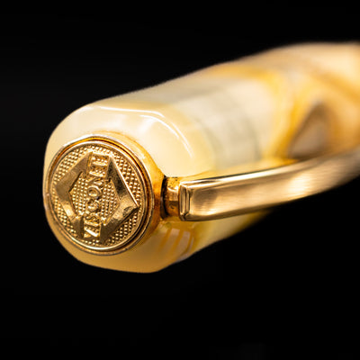 Zoomed-in view of the top of the cap with the finial on the Visconti Opera Club Honey Almond Resin Fountain Pen - Preowned.