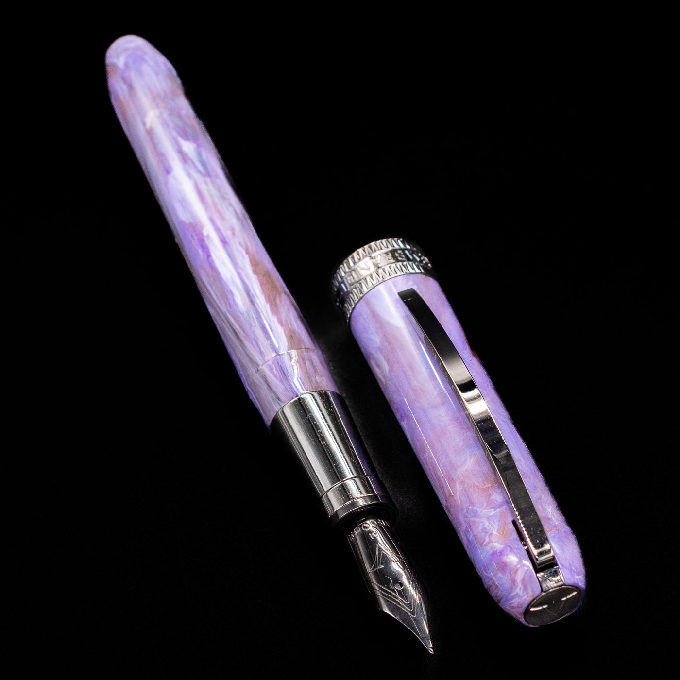 A full view of the Visconti Rembrandt S Fountain Pen - Lavender uncapped, with its cap laying next to the pen. 