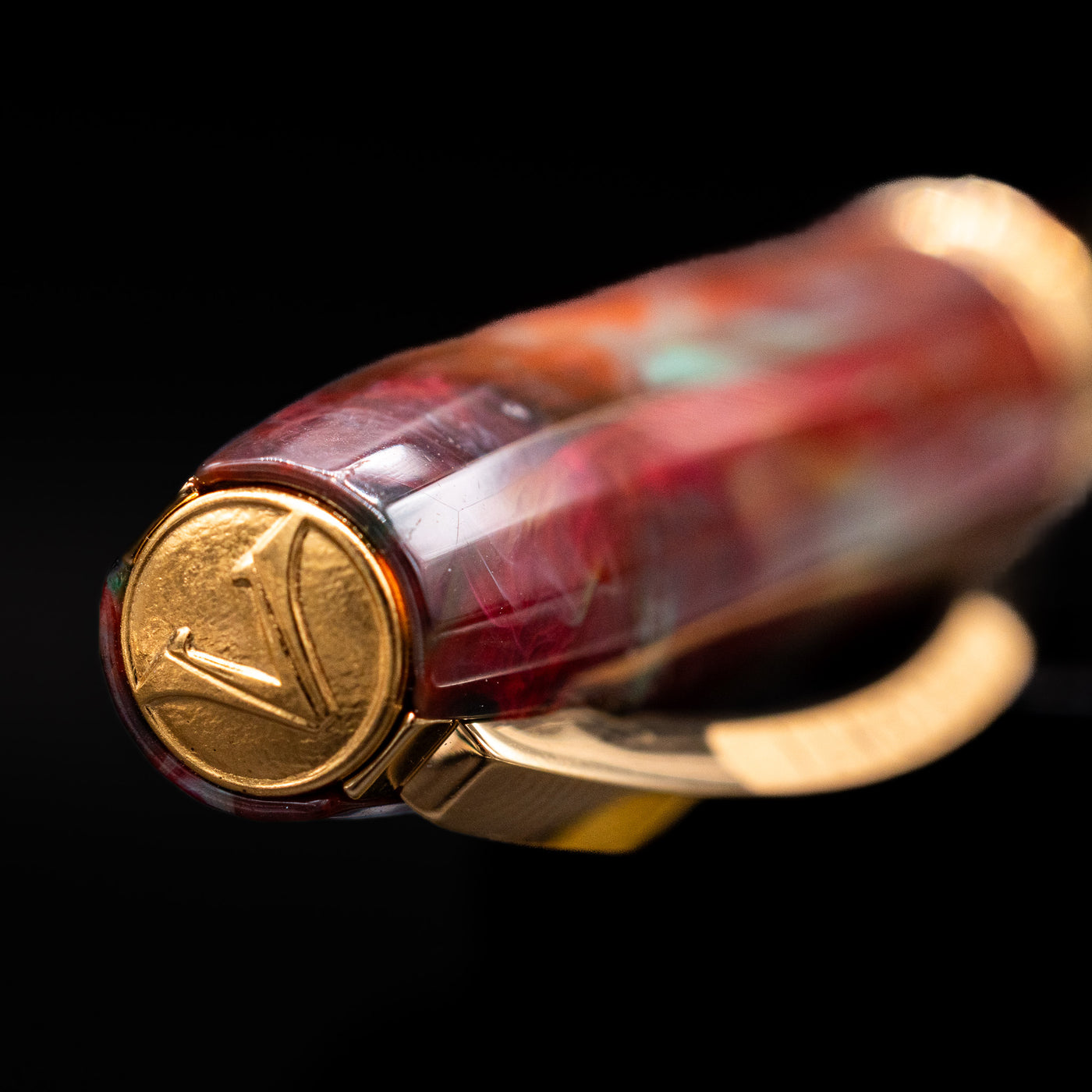 Zoomed-in view of the top of the cap with the Visconti finial on the Visconti Van Gogh Fountain Pen - Flowering Plum Orchard.