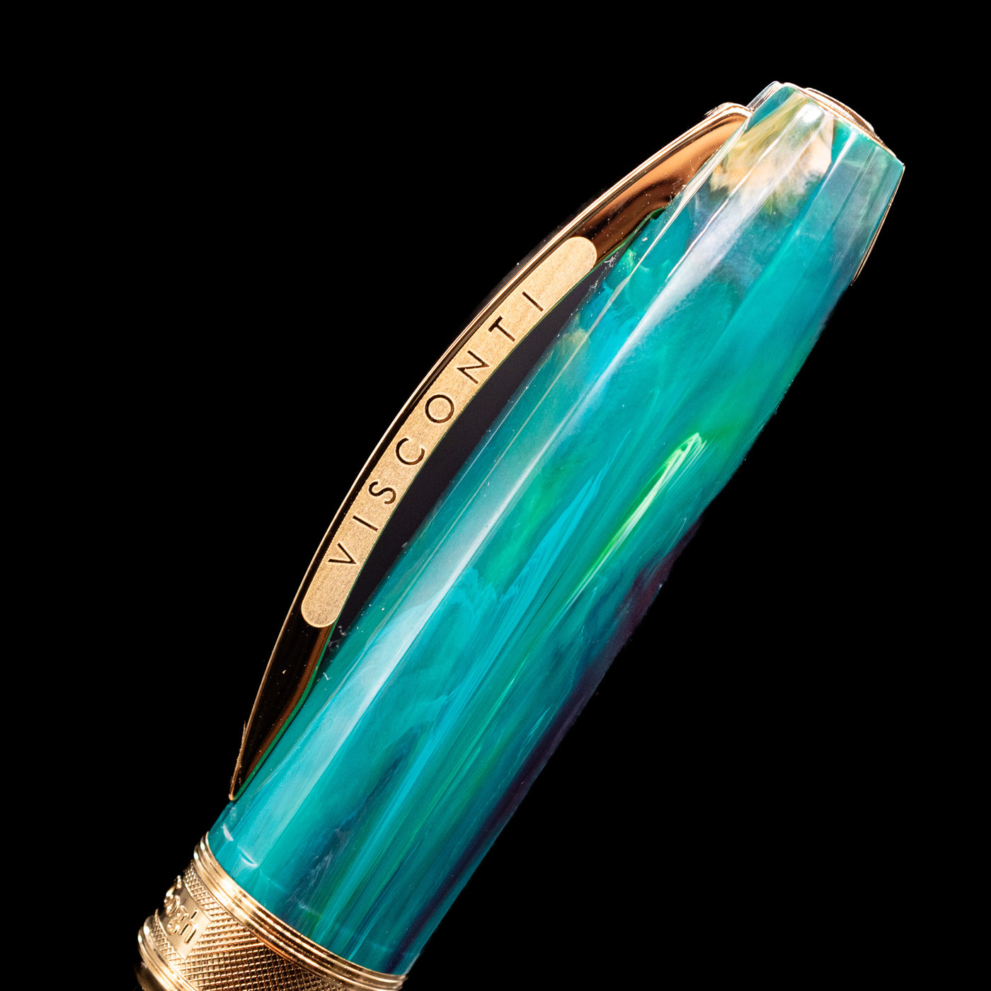 Close-up view of the cap and its bridge-like clip with the Visconti logo on the Visconti Van Gogh Fountain Pen - The Novel Reader.