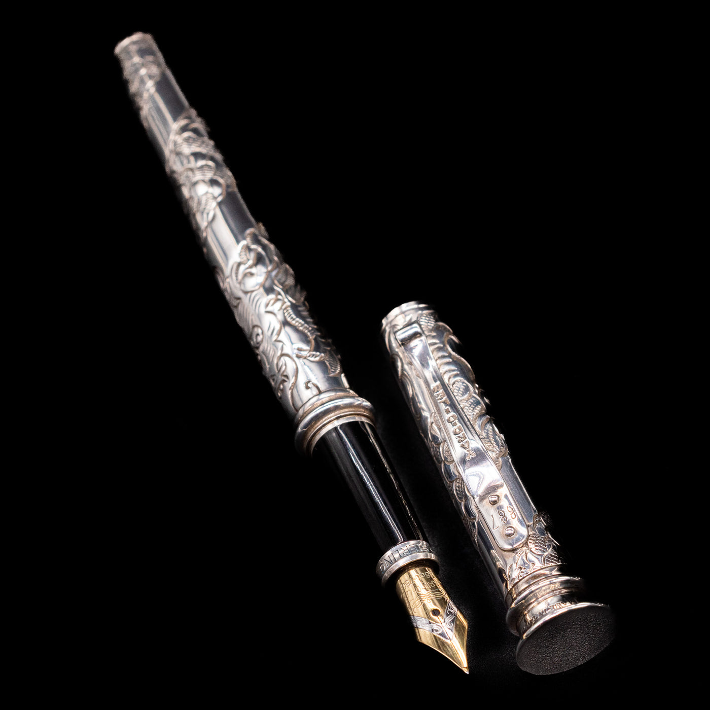 A full view of the Yard O Led Imperial Dragon Fountain Pen - Preowned uncapped, with its cap laying next to the pen. 