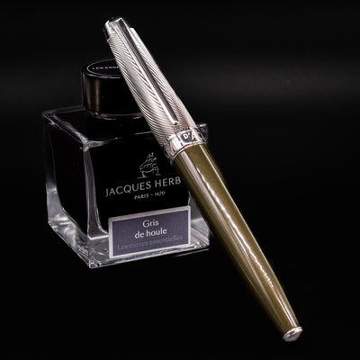 Capped Caran d'Ache Leman Terre d'Ombre Fountain Pen with silver patterned cap and olive green barrel