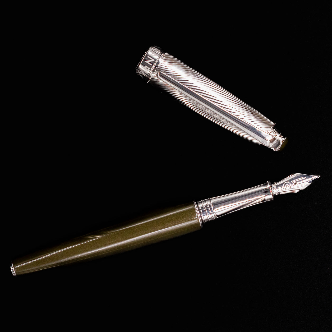 Disassembled view of Caran d'Ache Leman Terre d'Ombre Fountain Pen showing full pen and cap