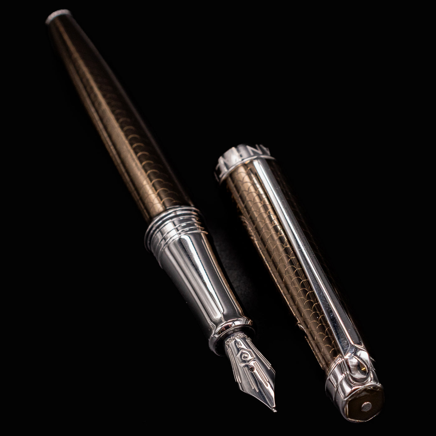 Caran d’Ache Léman V2 Caviar pen barrel and cap side by side, nib forward