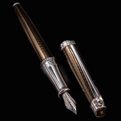 Caran d’Ache Léman V2 Caviar pen barrel and cap side by side, nib forward