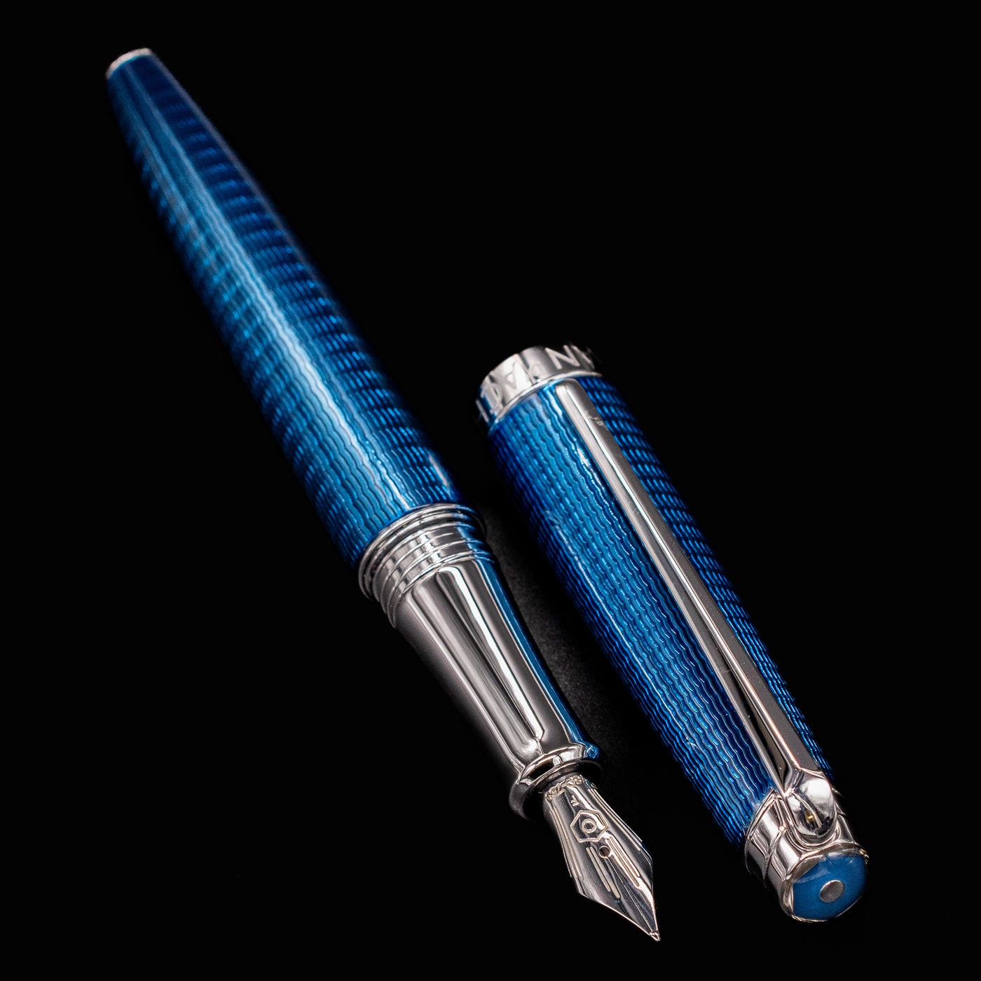 Barrel and cap of Grand Bleu pen side by side, nib aimed forward
