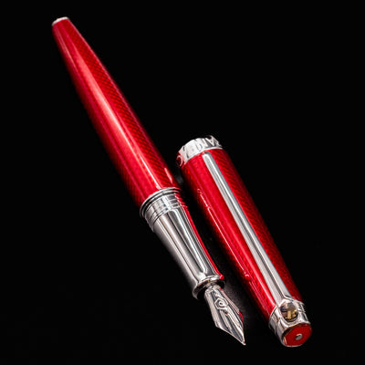 Rouge Carmin barrel and cap placed beside each other, nib angled forward