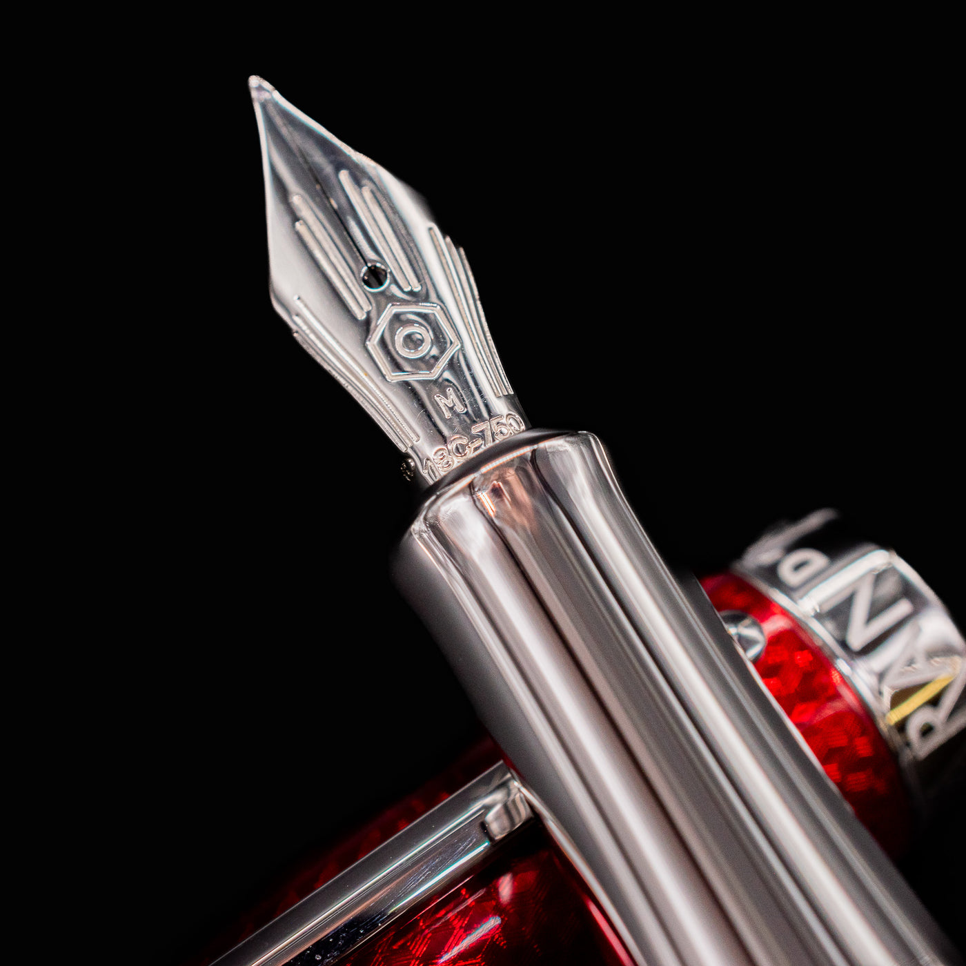 Closeup of 18k gold rhodium nib on Rouge Carmin fountain pen