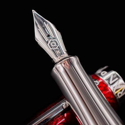 Closeup of 18k gold rhodium nib on Rouge Carmin fountain pen