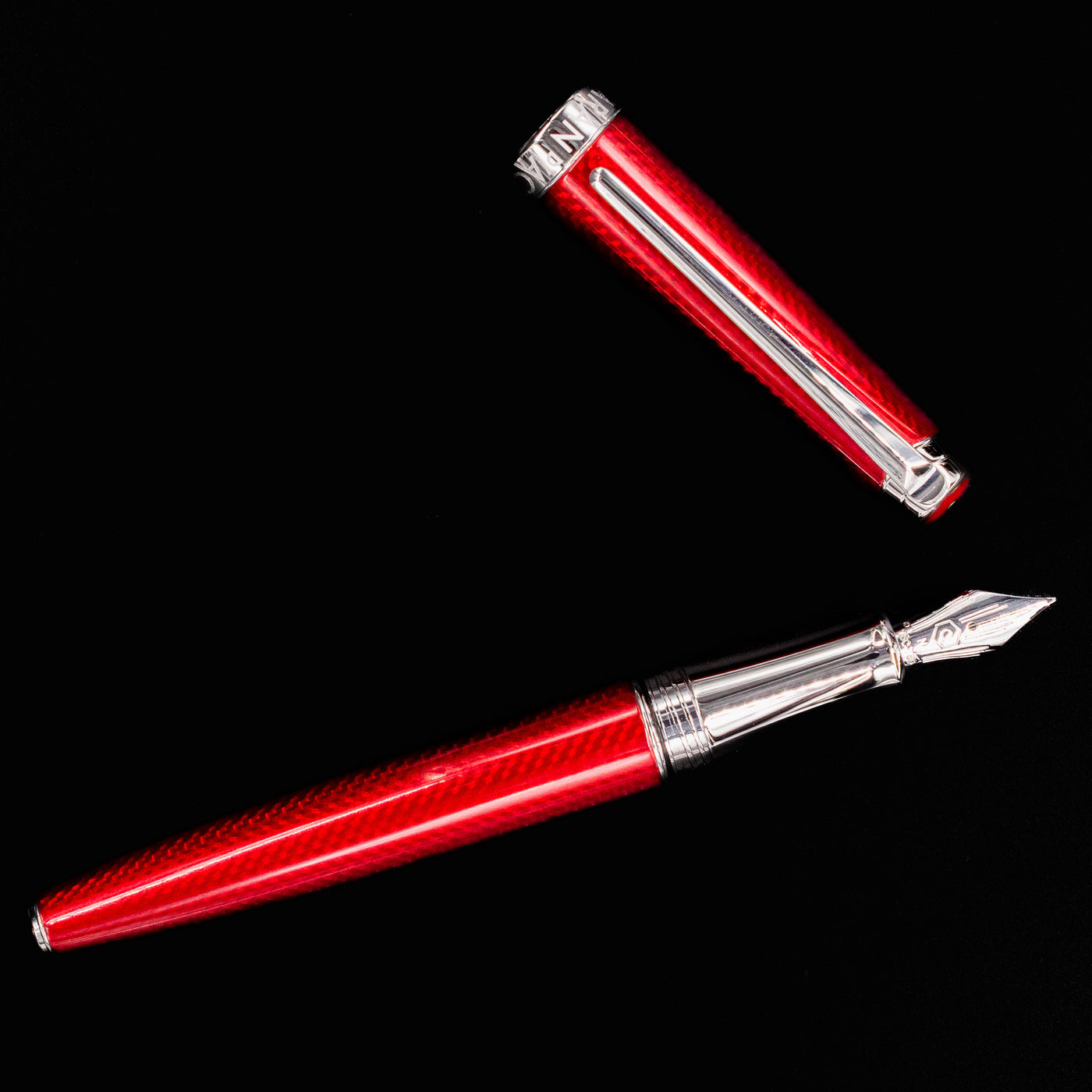 Overhead shot of the Caran d’Ache Léman V2 Rouge Carmin pen, uncapped
