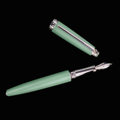 Overhead view of the Caran d’Ache Léman V2 Vert de Gris fountain pen, uncapped to display its full length and elegant silhouette.