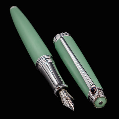 Léman V2 Vert de Gris pen and cap placed side-by-side with the nib pointing forward, highlighting shape and finish.

