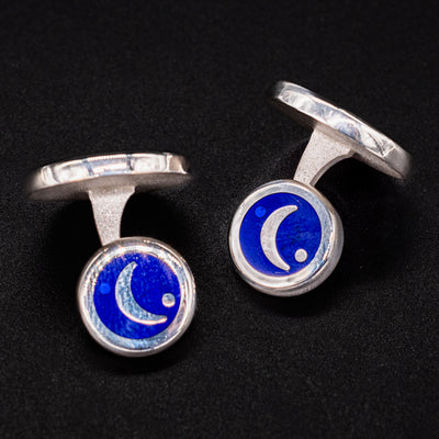 Close-up of David Oscarson Celestial Cufflinks featuring crescent moon in midnight blue enamel