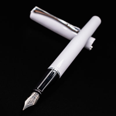 Close angled view of Diplomat Traveller Fountain Pen in White and Chrome with polished steel nib