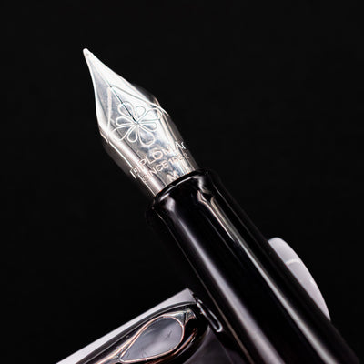 Macro shot of the Diplomat Traveller stainless steel nib engraved with logo and detailing
