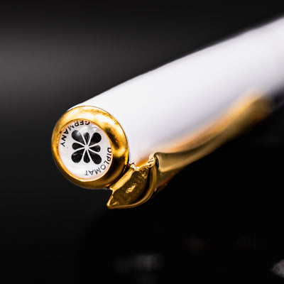 Close-up of the Diplomat Traveller pen finial showing the Diplomat Germany logo on the cap