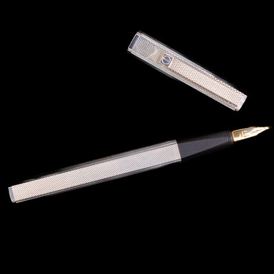 Top-down view of Dunhill Gemline Classic Dress Sterling Silver Fountain Pen and cap separated