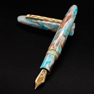 Esterbrook Estie Avalanche uncapped with nib aimed toward camera - handcrafted DiamondCast fountain pen