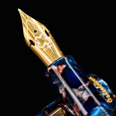 Macro shot of Esterbrook Estie Nouveau Bleu fountain pen gold nib with engraved details