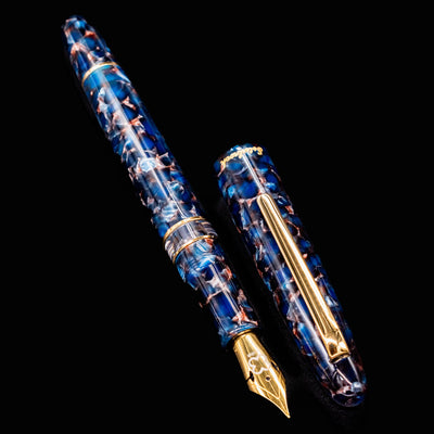 Esterbrook Estie Button Piston Fountain Pen in Nouveau Bleu with cap and pen side by side on black background